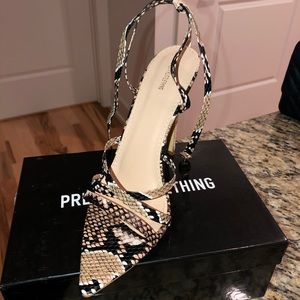 Strappy snake skin heels